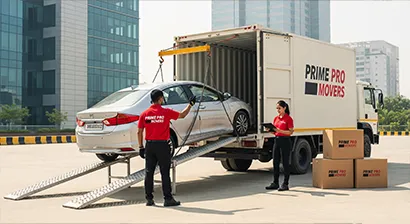 White sedan being loaded onto Prime Pro Movers enclosed carrier