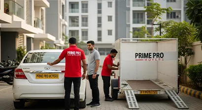 Mover inspecting sedan with customer before loading into transport trailer at gated society