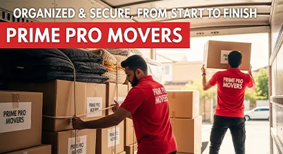 Team arranging and securing packed boxes inside a moving truck during a home relocation